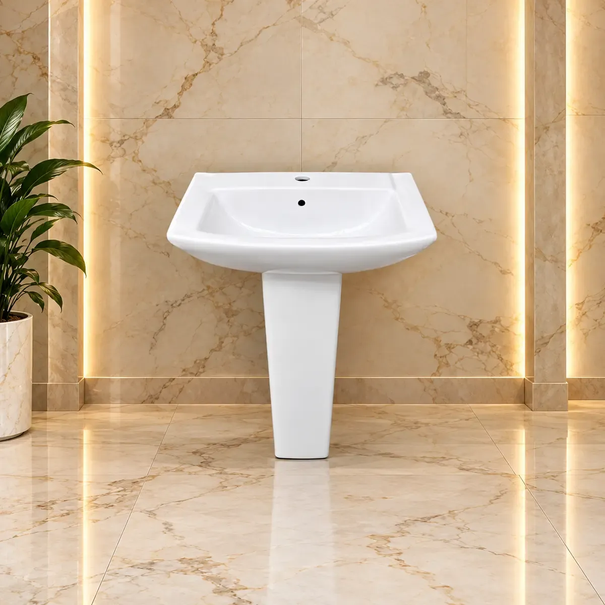 White rounded basin with a raised rear rim and a tapering pedestal.