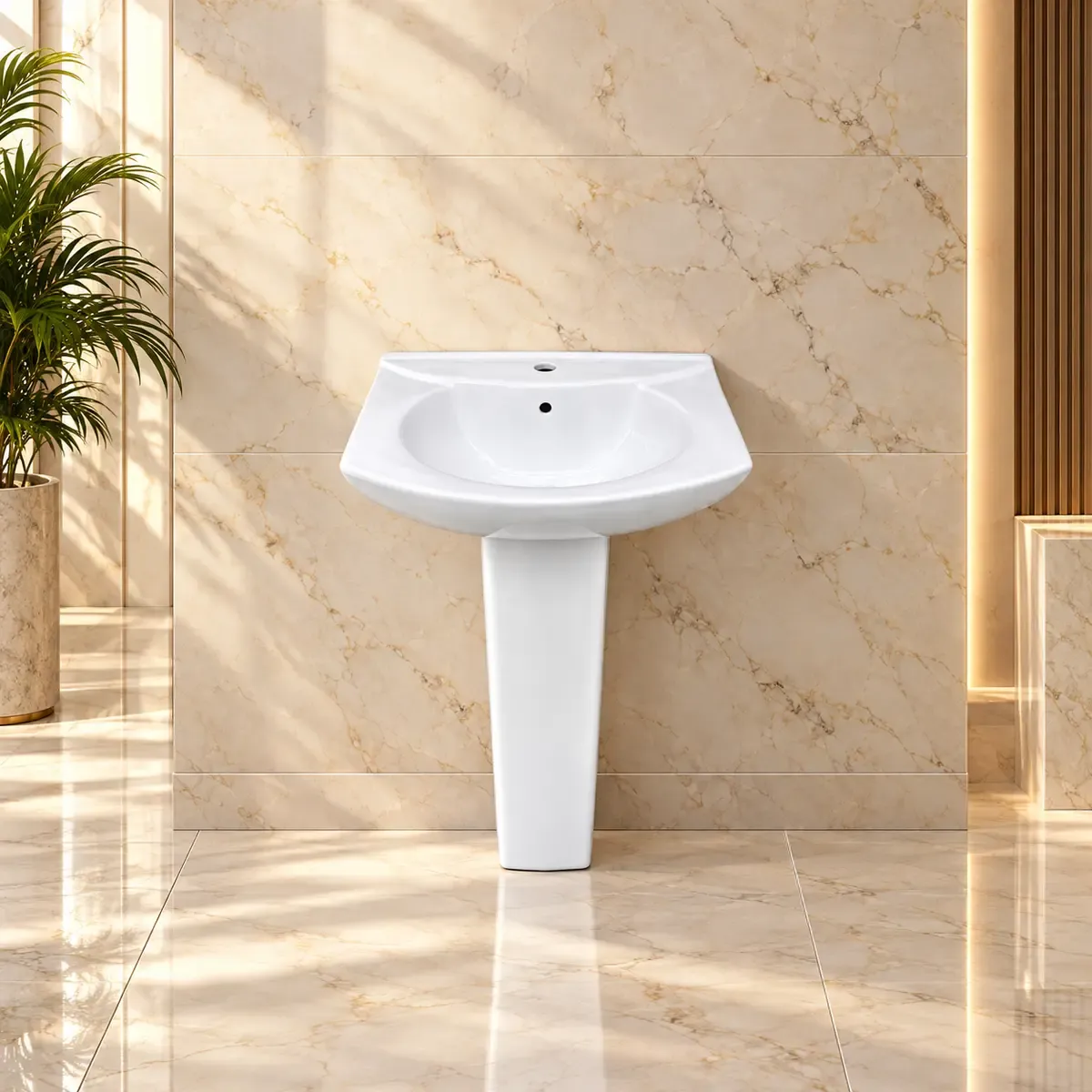 White basin with a rounded interior, squared outer rim and slim tapering pedestal.